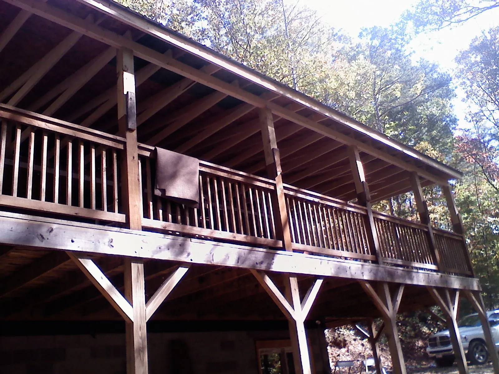 Timber framing under a new elevated porch and deck — Roof Leak Repair in Sweetser by Roofing Brothers